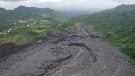 aerial view of the volcanic destruction left in the middle of a tropical rainforest, east java indonesia