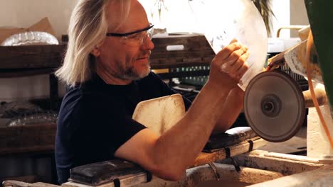 glassblowers working on a glass