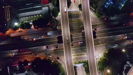 Overhead-View-Of-Highway-Intersection-In-The-City-At-Night-In-Kuningan-City,-South-Jakarta,-Indonesia
