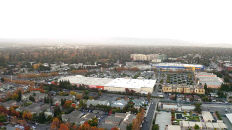 aerial view of a suburban landscape with a large commercial center and residential areas