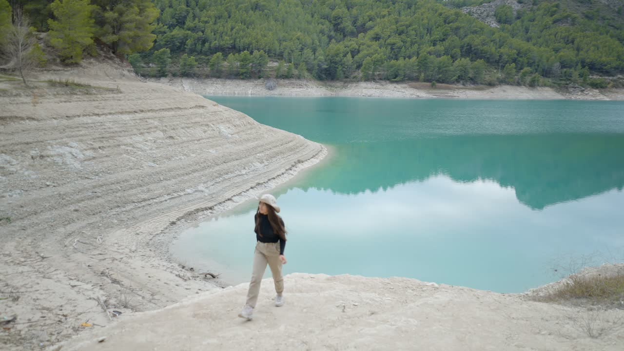 Woman Hiking at a Turquoise Mountain Lake