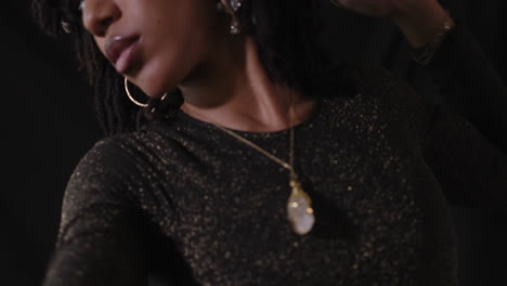 portrait body shot of young sensual african american women with black background