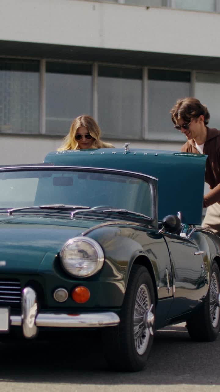 Couple enjoying a classic convertible