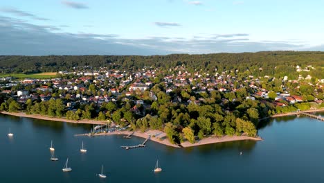 aerial view flying drone of town herrsching at ammersee lake, luxurious residential area with high class marina and beautiful view