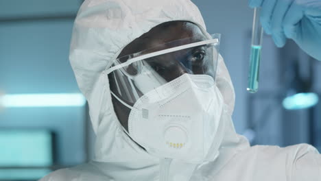 Black-Lab-Scientist-Examining-Chemical-in-Test-Tube