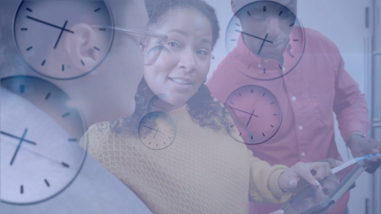 Center woman tapping tablet causing clock overlay, man pointing stylus, team ending business review
