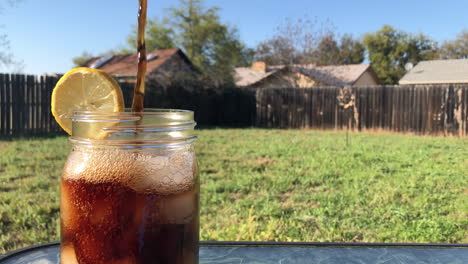 pouring sweet tea on a sunny day