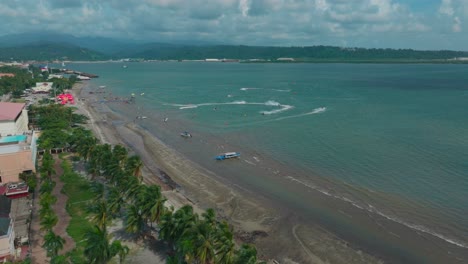 a wide drone shot captures the vast subic ocean, with jet skis slicing through the waves and boats cruising under the open sky.
