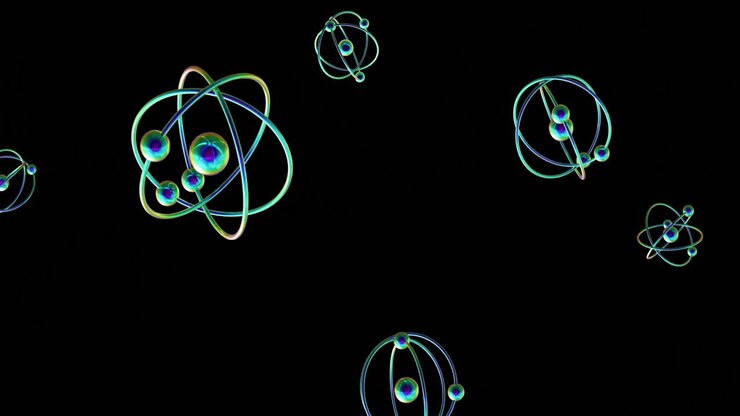 Animation of atom models spinning on black background