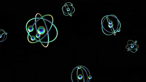 Animation of atom models spinning on black background