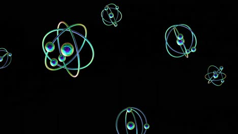 animation of atom models spinning on black background