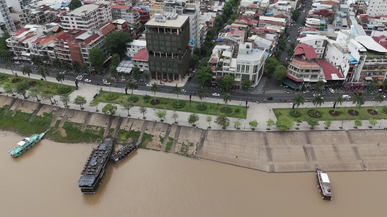 Aerial footage in Phnom Penh city center, Cambodia. Camera slides from left to right above the old quarter of the capital