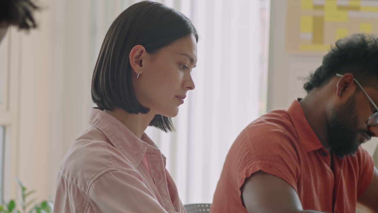 Young Female Student Passing Exam in School for Migrants