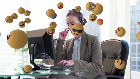 Animation-of-emoji-falling-over-business-people-wearing-phone-headsets