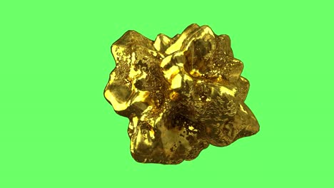 a piece of gold-colored metal nugget on a green background.