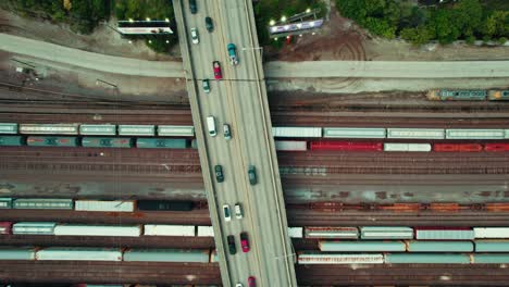 top-down-of-overpass-bridge,-train-with-tanks-freight-is-moving