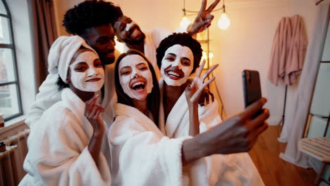 friends enjoying a fun spa day and taking selfies