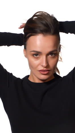 woman posing isolated on background. portrait of gorgeous young brunette woman with healthy hair. vertical video