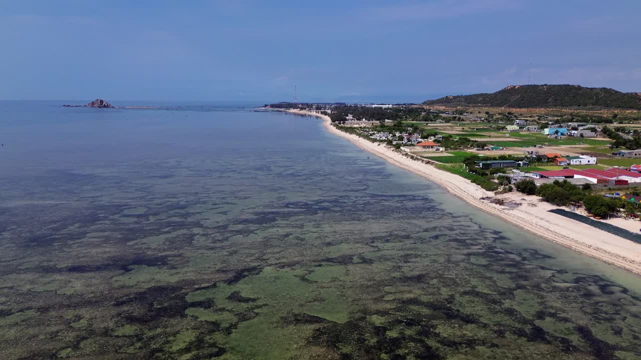 Beautiful aerial drone footage of My Hoa Lagoon with calm waters and lush tropical surroundings in Vietnam, perfect for travel and nature themes