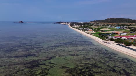 beautiful aerial drone footage of my hoa lagoon with calm waters and lush tropical surroundings in vietnam, perfect for travel and nature themes