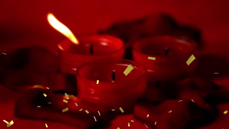 animación de confeti dorado sobre velas rojas