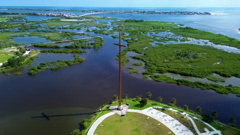 an incredible drone video flying around a cross along st. augustine inlet in florida.