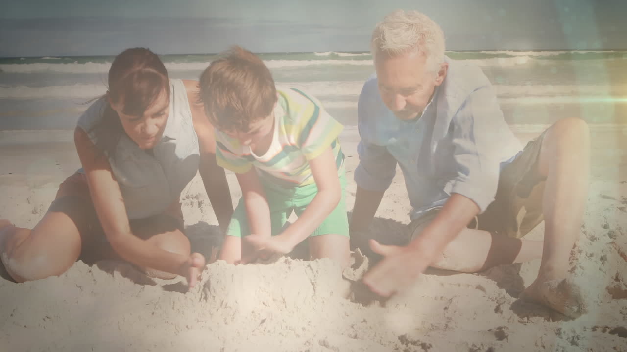 해변에서 딸과 손자와 함께 행복한 노인 위에 반이는 빛의 애니메이션