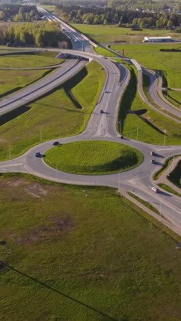 vertical view of katlakalns roundabout with grassy central mound and coniferous forest in latvia. aerial shot