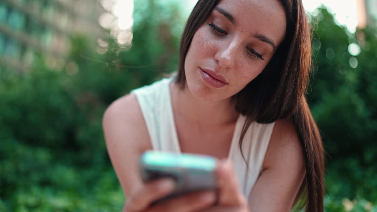 Woman using her mobile phone outdoors