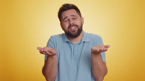 Young-man-showing-a-little-bit-gesture-with-sceptic-smile-showing-minimum-sign-measuring-small-size