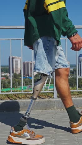 man with prosthetic leg walking in city