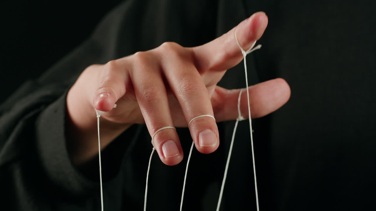 Human Hand Manipulating Strings Like a Puppeteer