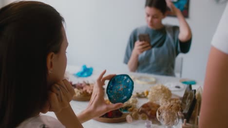 women creating resin art pieces