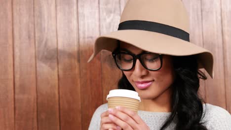 asian hipster drinking coffee to go