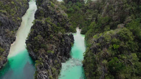 tilting aerial view revealing sandy white beach of big lagoon, el nido, palawan