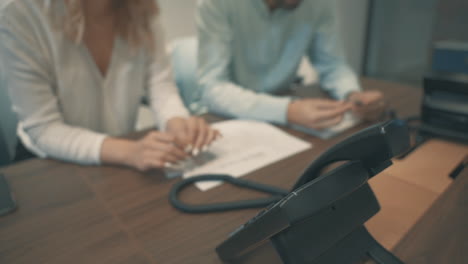 man and woman having a business call in the office