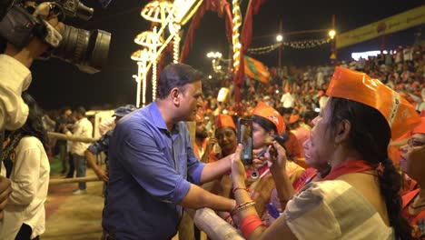 political event with crowd and interview