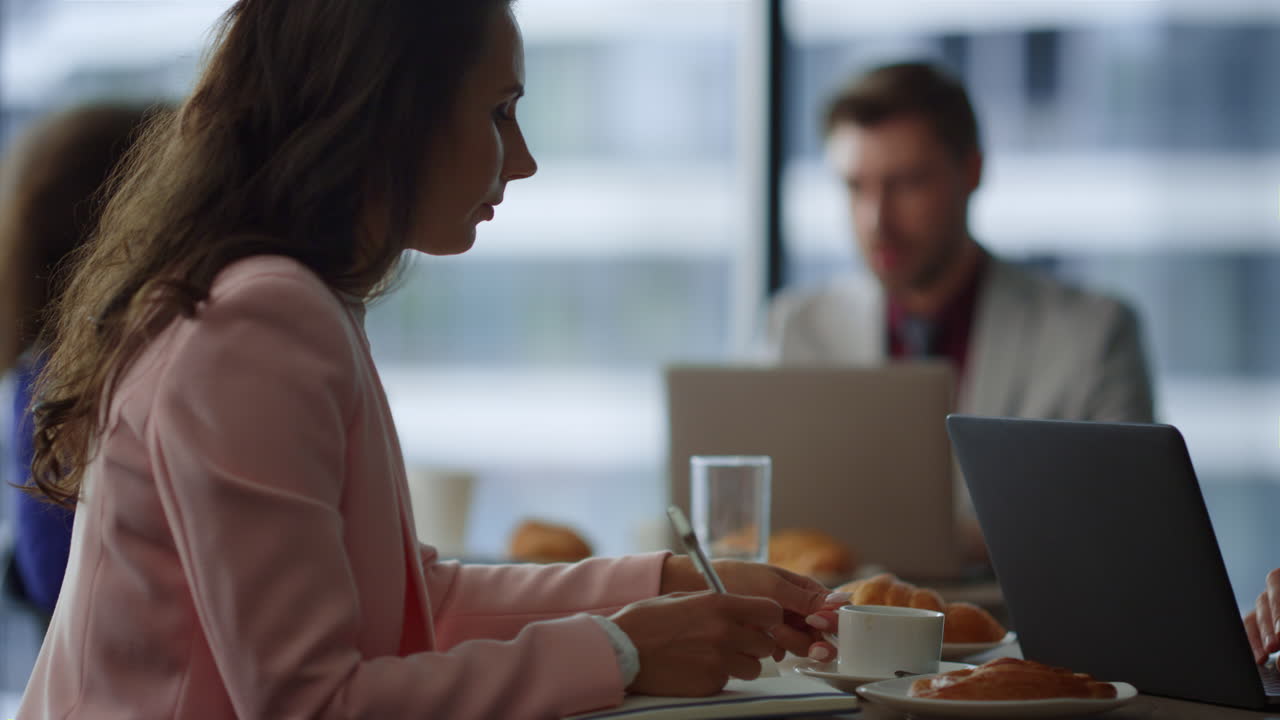 Beautiful business person drinking coffee