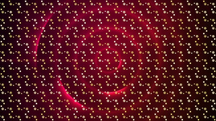 Digital animation of abstract pattern design against red spiral light trails on black background