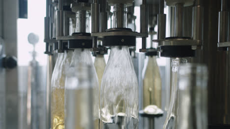 Amazing-wide-shot-of-machinery-that-fills-wine-bottles-inside-a-wine-factory-in-Burgos,-Spain