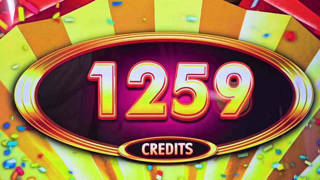 Slot machine screen flashing a win result with large credit number, gold border, confetti graphics, and neon casino reflections for gambling, gaming, and nightlife footage.