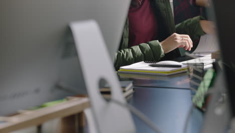 young african american businessman reading corporate documents brainstorming ideas using computer planning strategy in modern startup communication company