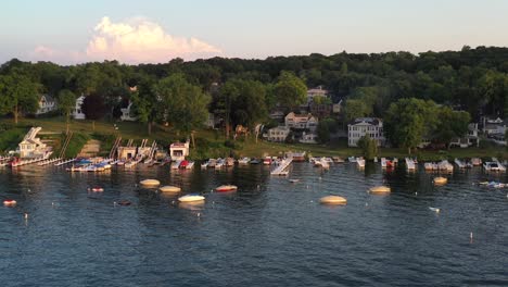 boats docked on the lake shore of cottage country of lake geneva, wisconsin from a aerial view