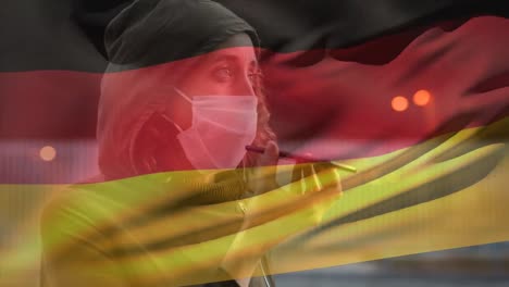 Deutsche-Flagge-Winkt-Gegen-Frau-Mit-Gesichtsmaske,-Die-Auf-Dem-Smartphone-Spricht