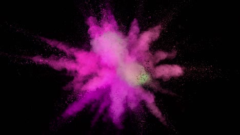 super slow motion of colored powder explosion isolated on dark background.