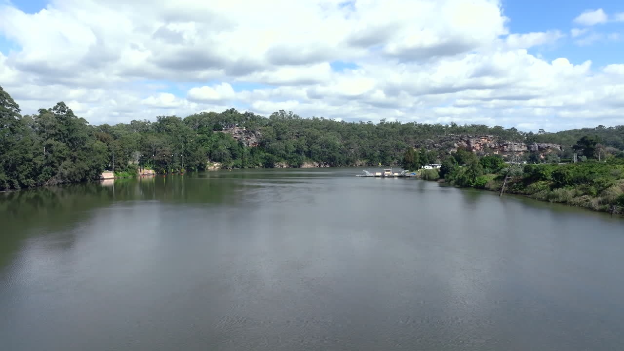 Drone shot showing the Sackville Ferry about to depart to the other side of the Hawkesbury river, Australia