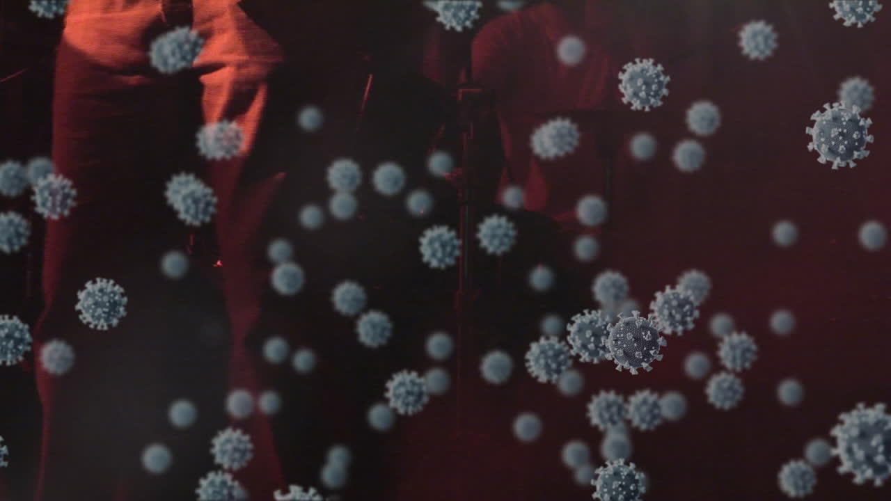 Digital composite video of covid-19 cells moving against musical band playing musical instruments