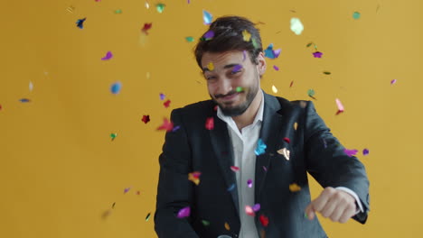 businessman celebrating with confetti