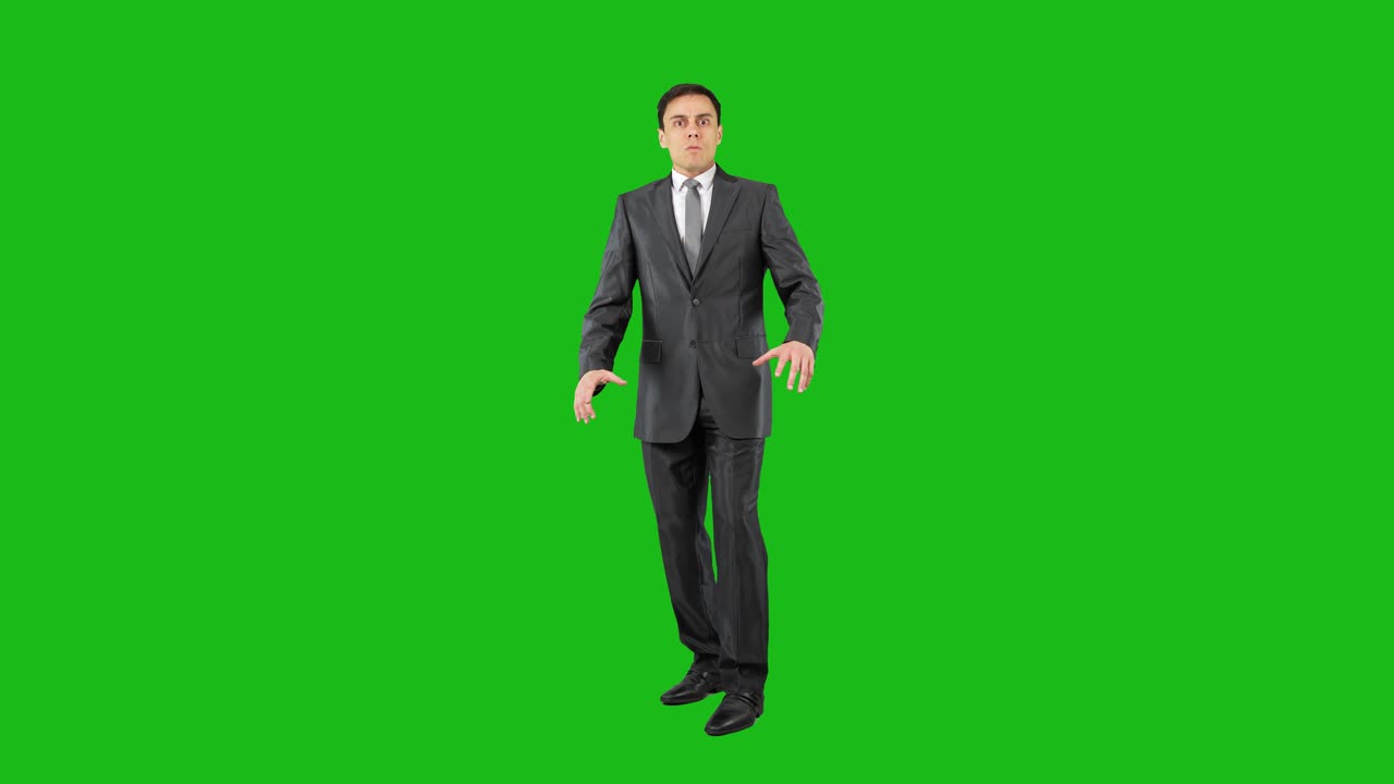 Man in Suit Expressing Various Emotions on Green Screen