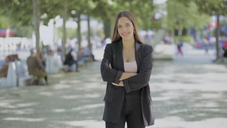 attractive young woman smiling at camera outdoor